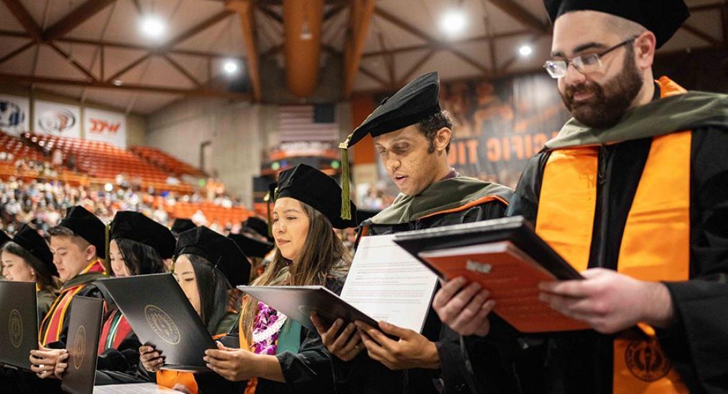 Pharmacy graduates reading their oaths