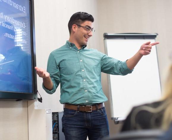 Man presenting to a business class